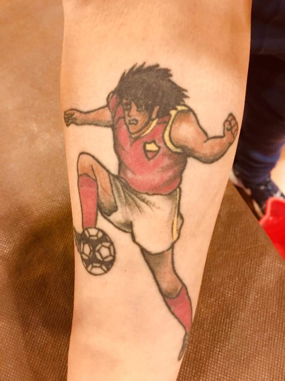 Tatuaggio pallone e clearance scarpini